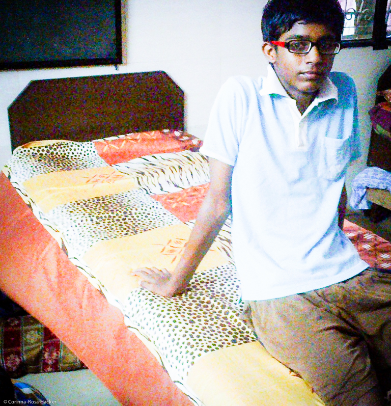 Bed_linens_with_a_Child_at_Udayan_Ghar__Boys
